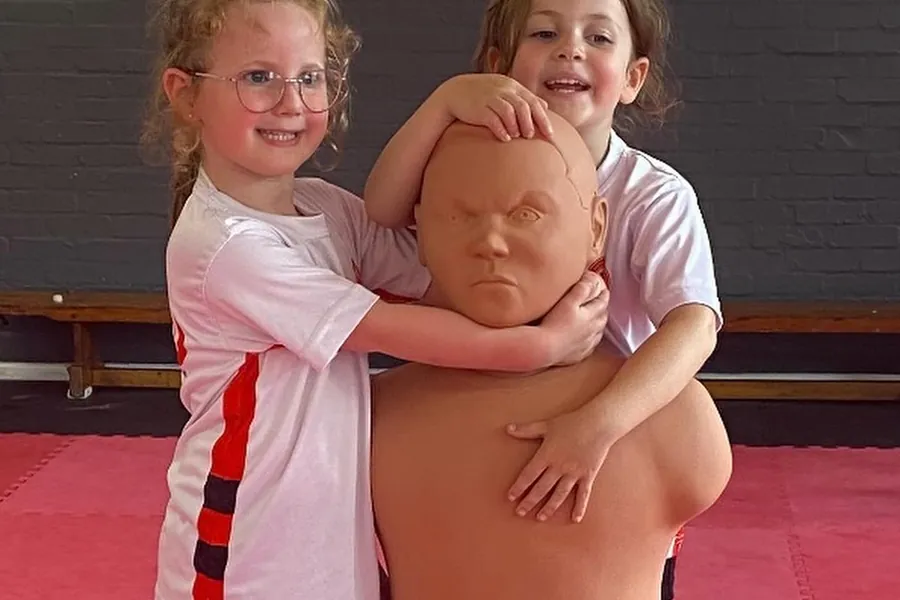 Two Little Warriors with the training dummy at WKO Llanelli